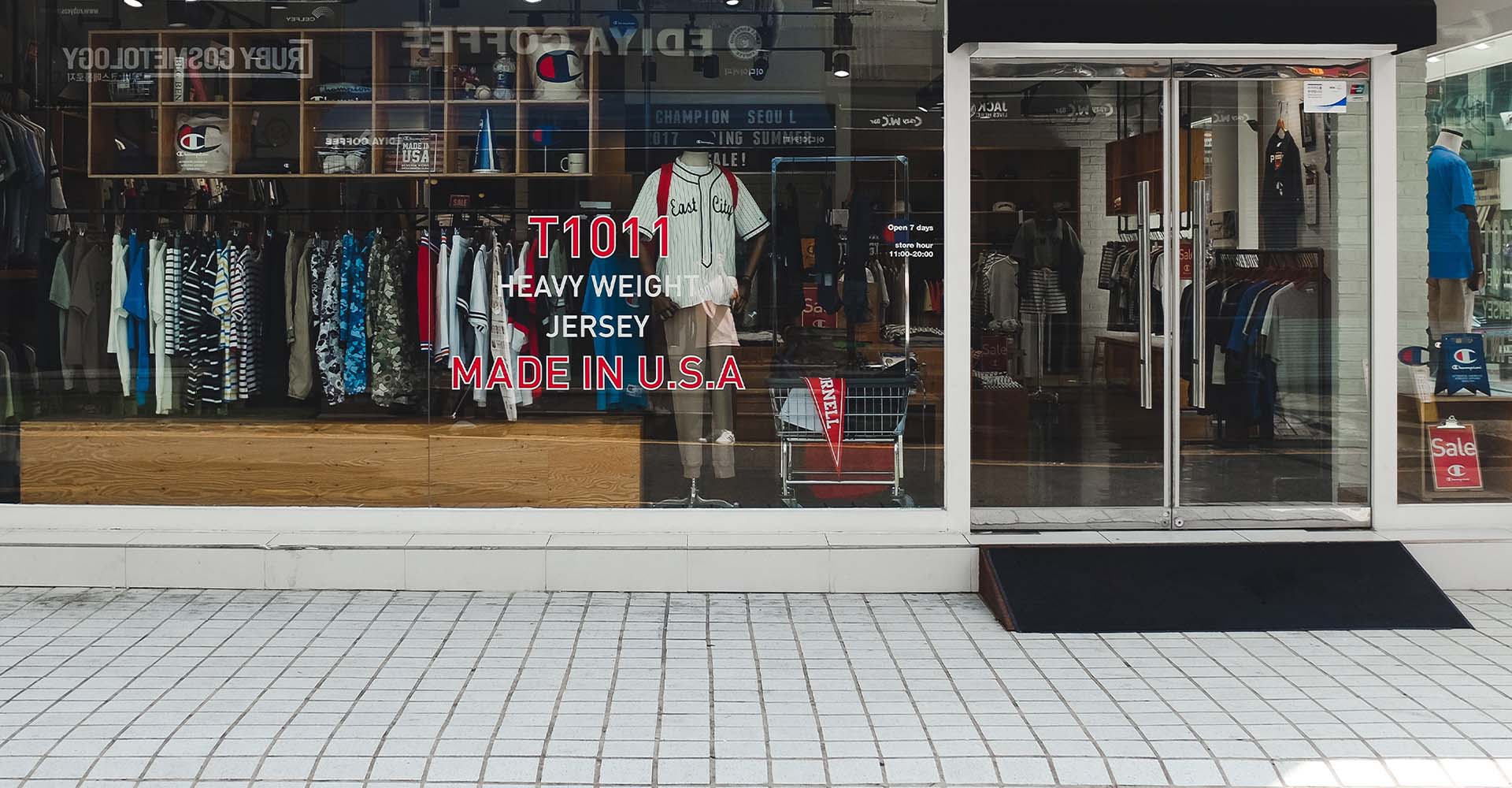 An apparel storefront with glass windows