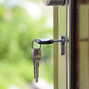 keys hanging in the lock of an open door