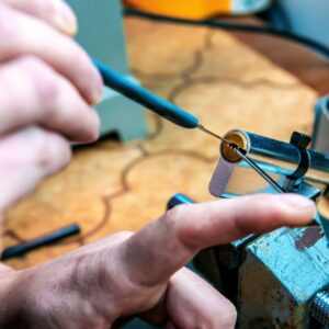 person repairing door lock
