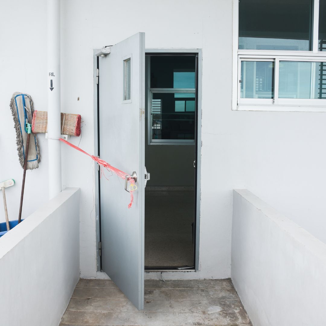 a door being propped open by a mop