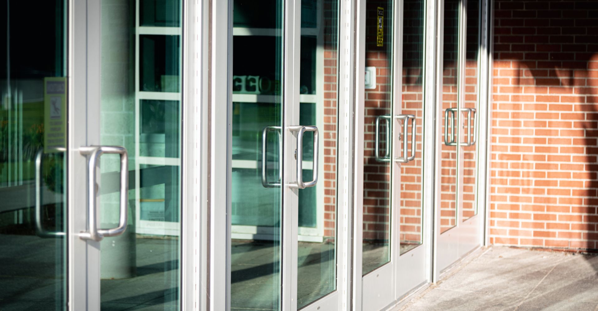 row of commercial exterior doors on a building