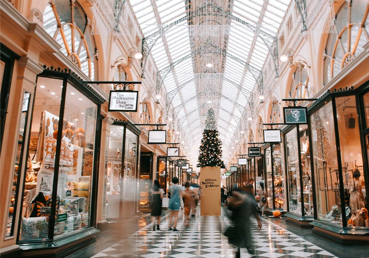 Interior view of a mall with many shops