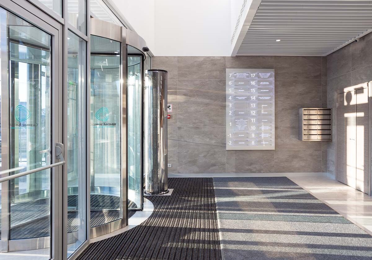 Interior view of a corporate business with a glass entry door and windows